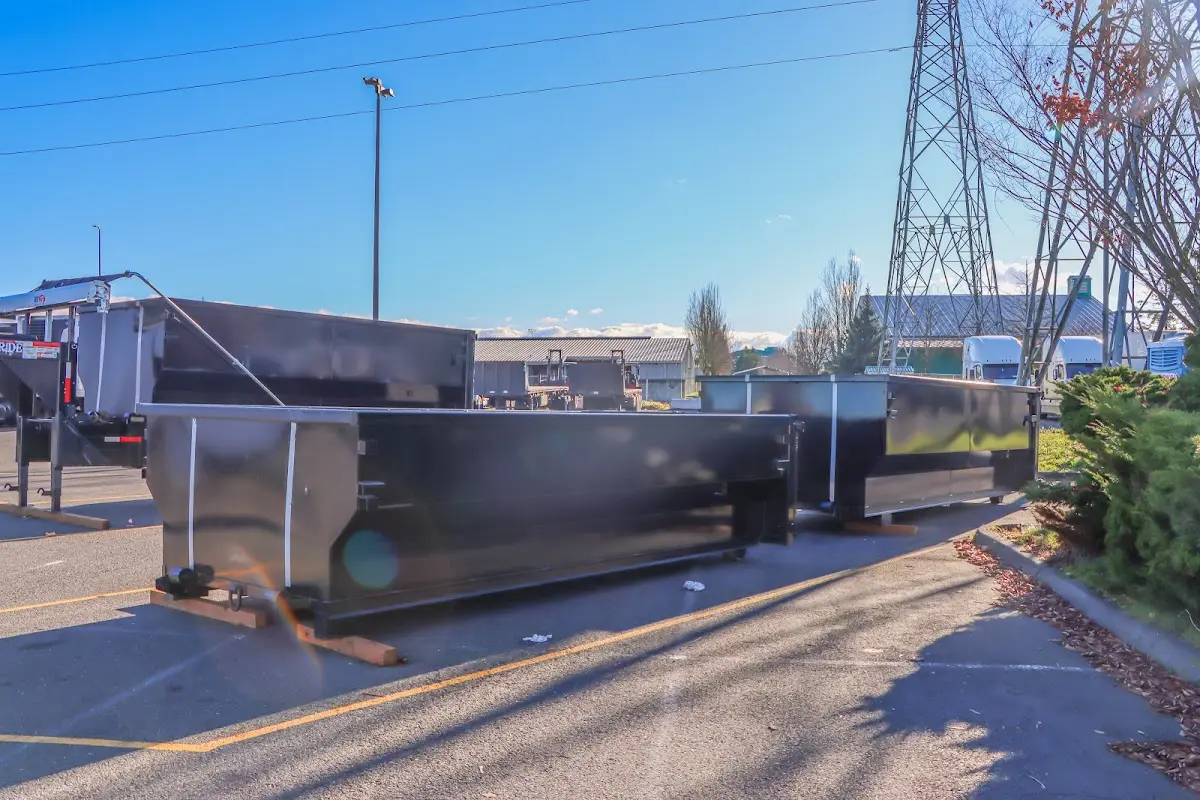 Roll-off dumpster ready for waste disposal at job site for Concrete Dumpster Rental in Harborcreek